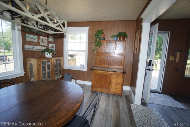 20375 Sumpter Rd, Belleville, MI 48111 - dining area featuring wooden walls and wood finished floors