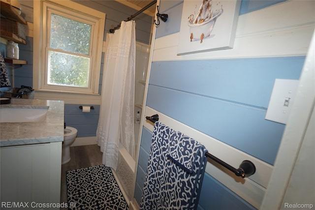 20375 Sumpter Rd, Belleville, MI 48111 - full bath featuring shower / bath combo, vanity, and wood finished floors