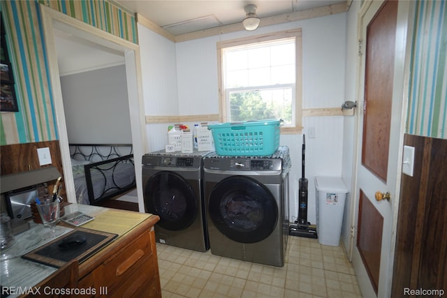 20375 Sumpter Rd, Belleville, MI 48111 - laundry room with light flooring, separate washer and dryer, wallpapered walls, and a wainscoted wall