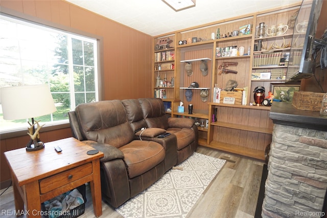20375 Sumpter Rd, Belleville, MI 48111 - living room featuring wood finished floors, healthy amount of natural light, and wooden walls