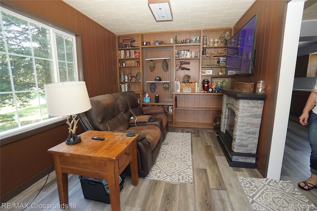 20375 Sumpter Rd, Belleville, MI 48111 - living area with wood finished floors and a stone fireplace