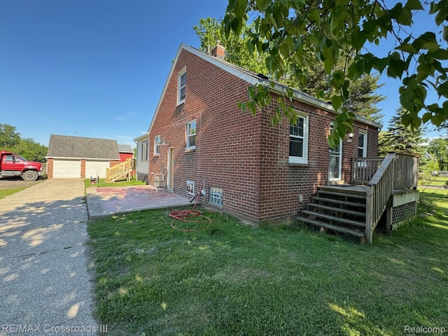 20375 Sumpter Rd, Belleville, MI 48111 - view of side of property with a chimney, brick siding, a yard, and an outdoor structure