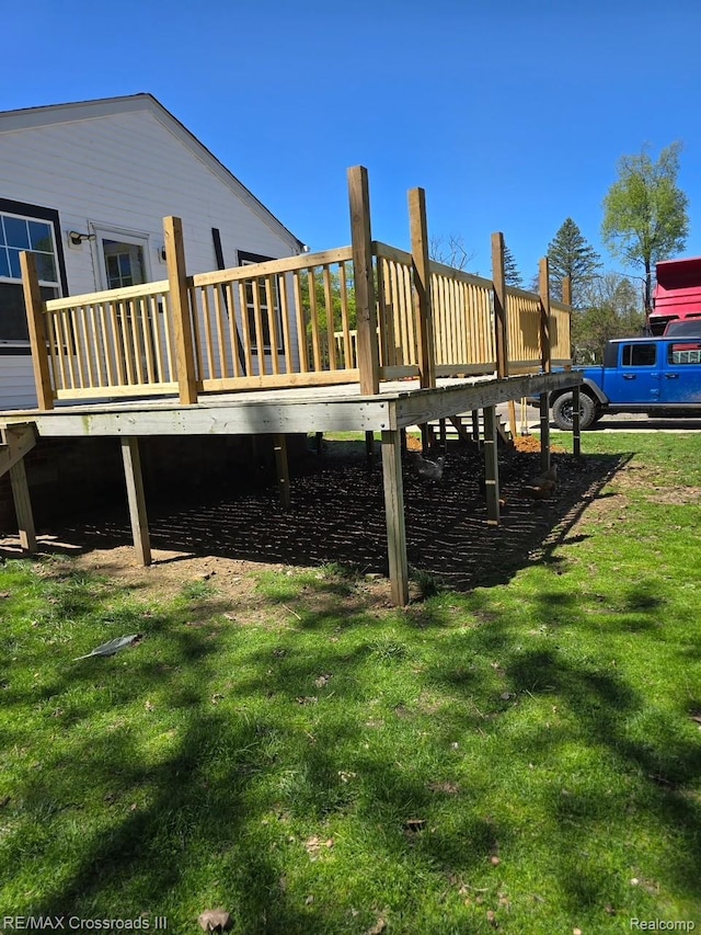 20375 Sumpter Rd, Belleville, MI 48111 - exterior space with a deck and a lawn