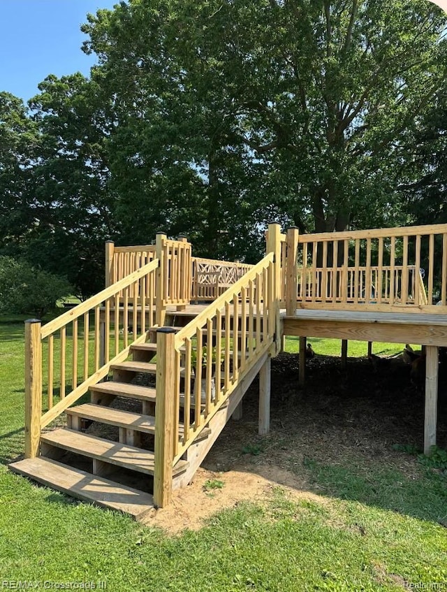 20375 Sumpter Rd, Belleville, MI 48111 - wooden deck with stairway and view of wooded area
