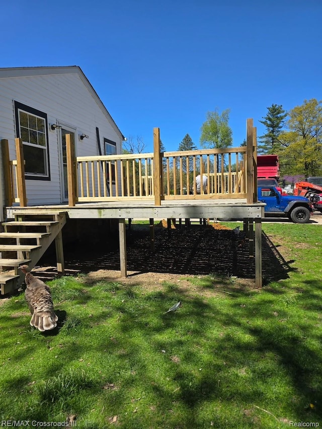 20375 Sumpter Rd, Belleville, MI 48111 - view of grassy yard featuring a wooden deck and stairs