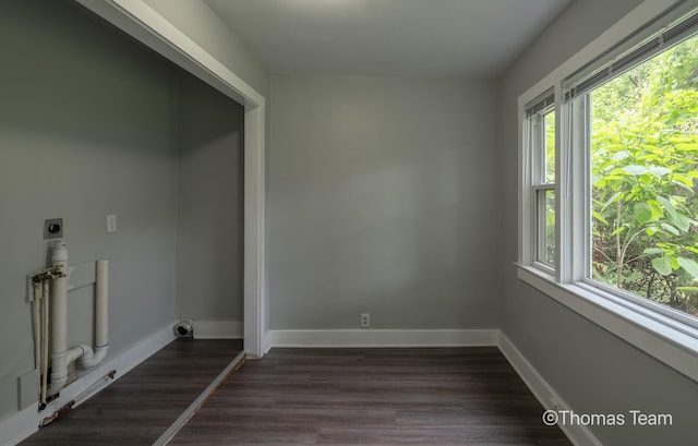 41 Grove St NE, Grand Rapids, MI 49505 - laundry area featuring electric dryer hookup, healthy amount of natural light, and baseboards