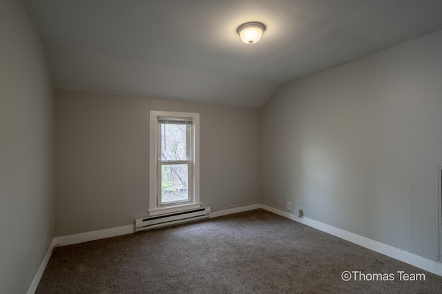 41 Grove St NE, Grand Rapids, MI 49505 - empty room featuring baseboard heating, vaulted ceiling, dark carpet, and baseboards