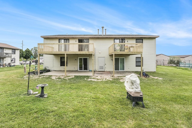 41 E 48th St, Holland, MI 49423 - back of house with a patio, a lawn, and a balcony