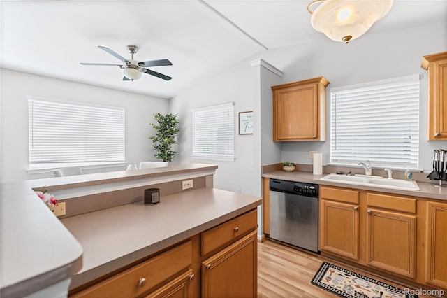 1015 Timber Ridge Ct, Grand Blanc, MI 48439 - kitchen featuring stainless steel dishwasher, a sink, ceiling fan, light wood-type flooring, and light countertops
