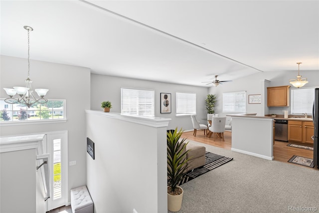 1015 Timber Ridge Ct, Grand Blanc, MI 48439 - entryway with healthy amount of natural light, a chandelier, light colored carpet, vaulted ceiling, and ceiling fan
