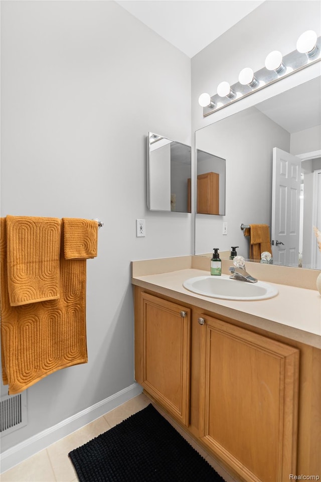 1015 Timber Ridge Ct, Grand Blanc, MI 48439 - bathroom featuring tile patterned flooring, vanity, and baseboards