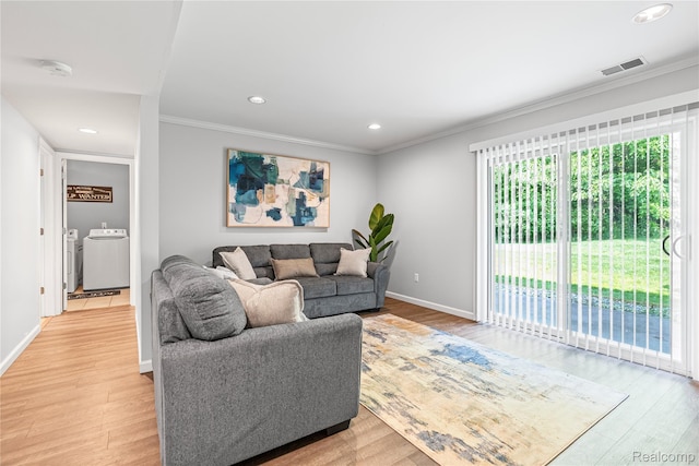 1015 Timber Ridge Ct, Grand Blanc, MI 48439 - living area featuring washing machine and dryer, crown molding, plenty of natural light, light wood-type flooring, and recessed lighting