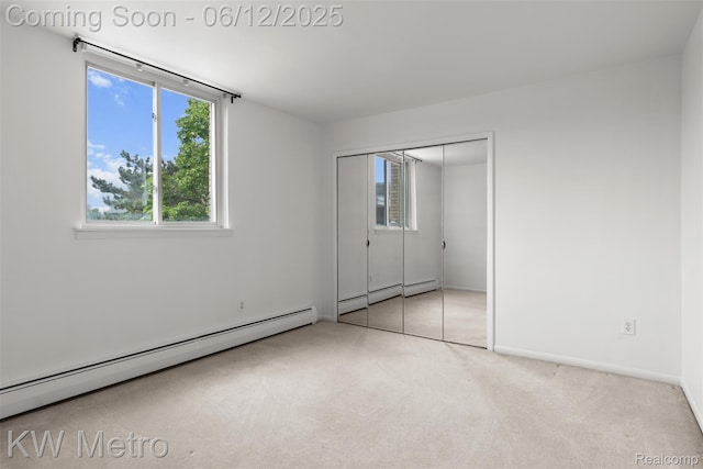 4909 Crooks Rd Unit E8, Royal Oak, MI 48073 - unfurnished bedroom with a baseboard radiator, carpet, a closet, and baseboards