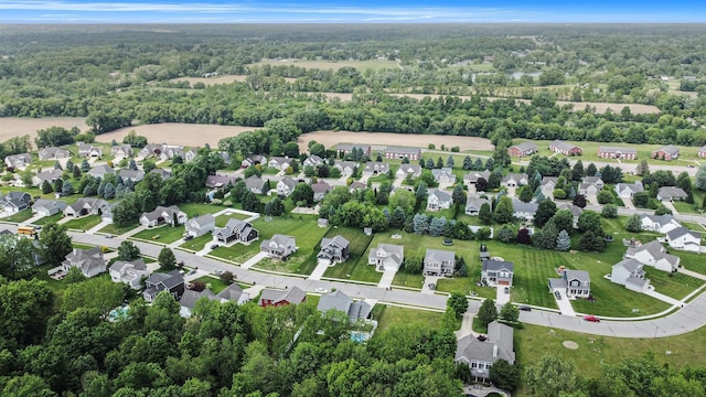 82 Dickens St, Spring Arbor, MI 49283 - aerial view of property and surrounding area with a heavily wooded area and nearby suburban area