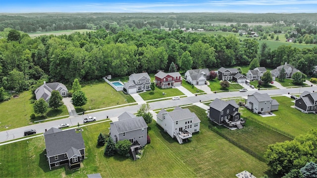 82 Dickens St, Spring Arbor, MI 49283 - aerial view of residential area featuring a heavily wooded area