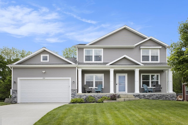 82 Dickens St, Spring Arbor, MI 49283 - view of front of house with driveway, a front yard, an attached garage, and a porch