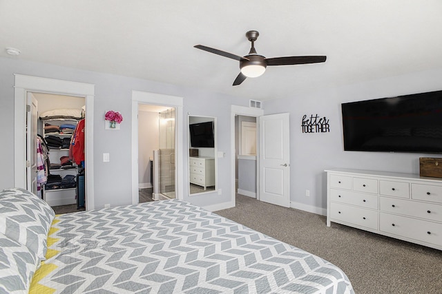 82 Dickens St, Spring Arbor, MI 49283 - carpeted bedroom with a spacious closet, baseboards, a closet, connected bathroom, and ceiling fan