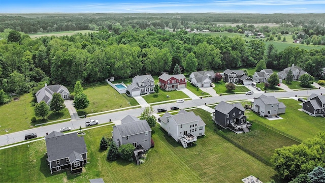82 Dickens St, Spring Arbor, MI 49283 - aerial view of residential area with a heavily wooded area