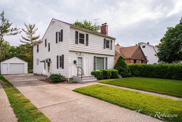 844 Dorroll St NE, Grand Rapids, MI 49505 - colonial-style house with a chimney, a garage, an outdoor structure, concrete driveway, and a front yard