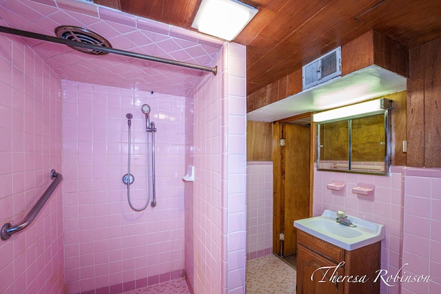 844 Dorroll St NE, Grand Rapids, MI 49505 - full bath with tiled shower, vanity, and tile walls