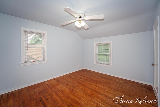 844 Dorroll St NE, Grand Rapids, MI 49505 - additional living space featuring lofted ceiling, healthy amount of natural light, baseboards, and wood finished floors