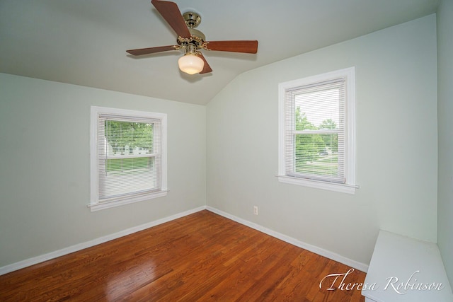 844 Dorroll St NE, Grand Rapids, MI 49505 - unfurnished room with vaulted ceiling, baseboards, a ceiling fan, and wood finished floors