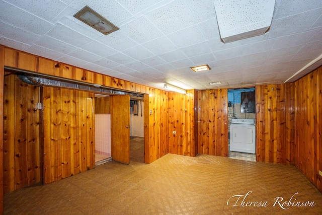 844 Dorroll St NE, Grand Rapids, MI 49505 - finished below grade area featuring washer / clothes dryer, wooden walls, and tile patterned floors