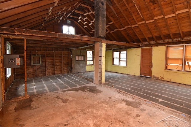 2114 Walter Rd, Beaverton, MI 48612 - miscellaneous room featuring electric panel and vaulted ceiling