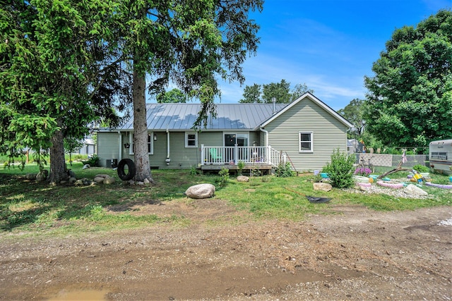 1027 E Railroad St, Hastings, MI 49058 - back of property featuring a deck and metal roof