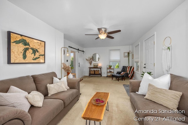 620 Emerald Ave NE, Grand Rapids, MI 49503 - living room featuring a barn door, ceiling fan, and light carpet