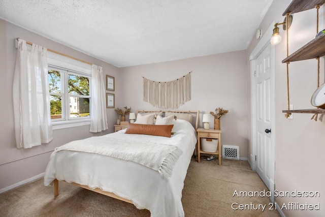 620 Emerald Ave NE, Grand Rapids, MI 49503 - carpeted bedroom with baseboards and a textured ceiling