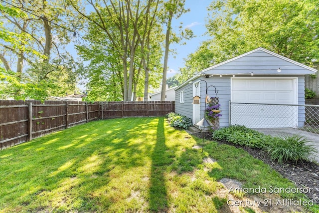 620 Emerald Ave NE, Grand Rapids, MI 49503 - view of yard featuring a detached garage and an outdoor structure