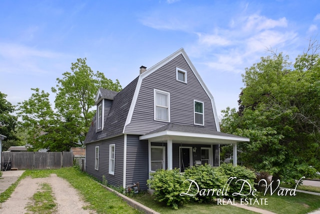 1107 Fountain St NE, Grand Rapids, MI 49503 - view of home's exterior featuring a gambrel roof, a chimney, and a shingled roof