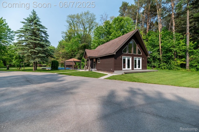 3591 Curry Rd, Caro, MI 48723 - view of home's exterior with french doors, a yard, and a gazebo