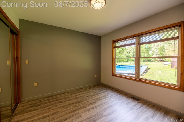 3591 Curry Rd, Caro, MI 48723 - empty room featuring wood finished floors and baseboards