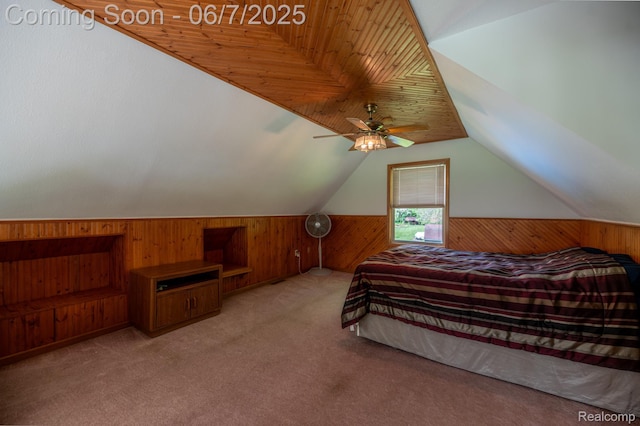 3591 Curry Rd, Caro, MI 48723 - carpeted bedroom featuring wooden walls, lofted ceiling, wainscoting, and ceiling fan