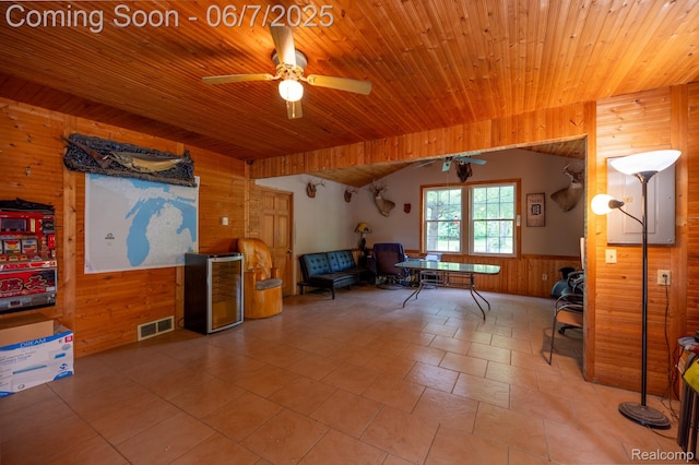 3591 Curry Rd, Caro, MI 48723 - sitting room featuring wood walls, a ceiling fan, a wainscoted wall, wood ceiling, and vaulted ceiling