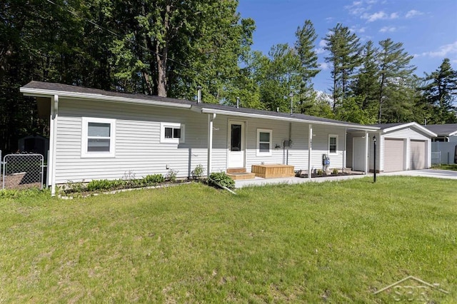 2832 N W River Rd, Sanford, MI 48657 - view of front of house with a garage, concrete driveway, and a porch