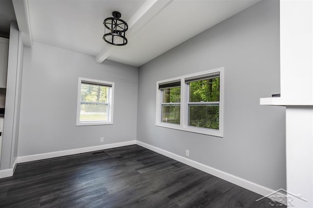 2832 N W River Rd, Sanford, MI 48657 - spare room featuring beam ceiling, baseboards, dark wood-style floors, and a chandelier