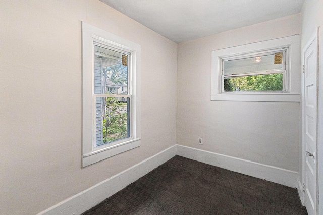 904 Riverview Ave, Lansing, MI 48915 - unfurnished room featuring baseboards and plenty of natural light