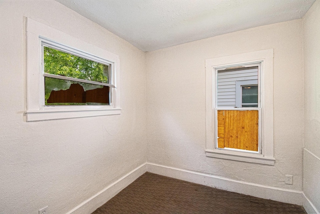 904 Riverview Ave, Lansing, MI 48915 - spare room with baseboards