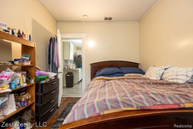 2977 Canton St, Detroit, MI 48207 - bedroom featuring ornamental molding and wood finished floors