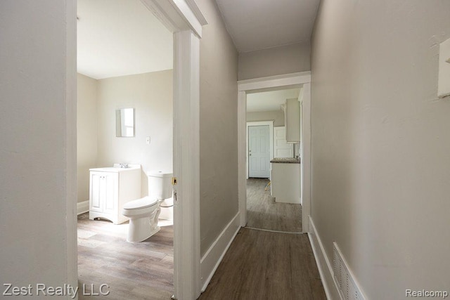 2977 Canton St, Detroit, MI 48207 - corridor with wood finished floors and baseboards