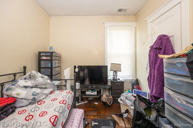 2977 Canton St, Detroit, MI 48207 - bedroom with crown molding and wood finished floors