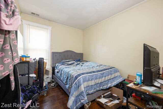 2977 Canton St, Detroit, MI 48207 - bedroom with crown molding and wood finished floors