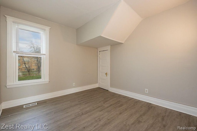 2977 Canton St, Detroit, MI 48207 - bonus room with wood finished floors, baseboards, and vaulted ceiling