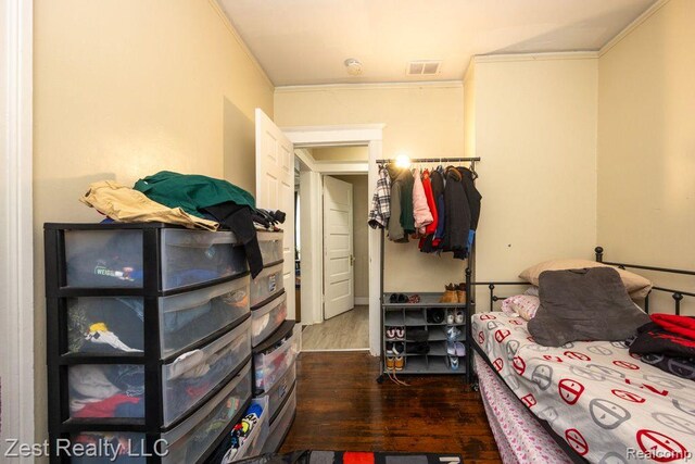 2977 Canton St, Detroit, MI 48207 - bedroom featuring crown molding and dark wood finished floors