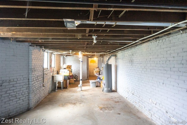 2977 Canton St, Detroit, MI 48207 - below grade area featuring gas water heater and brick wall