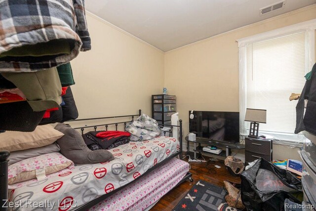 2977 Canton St, Detroit, MI 48207 - bedroom with ornamental molding, wood finished floors, and vaulted ceiling