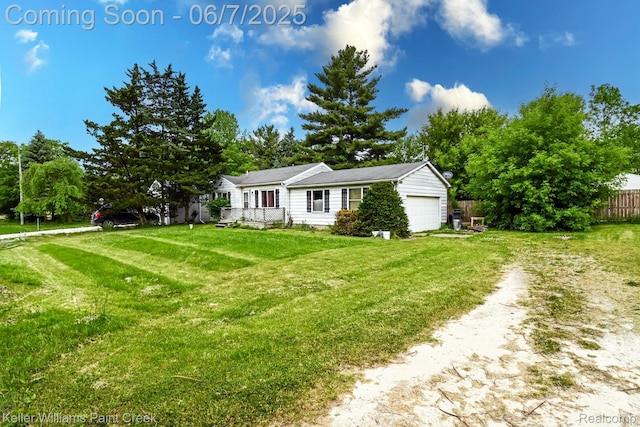 3500 Hogarth Ave, Flint, MI 48532 - view of front facade featuring a garage and driveway